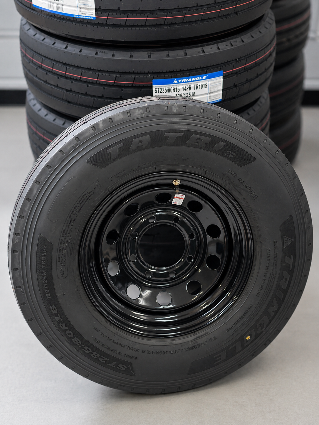 New Triangle ST235/80R16 trailer tire on a black wheel