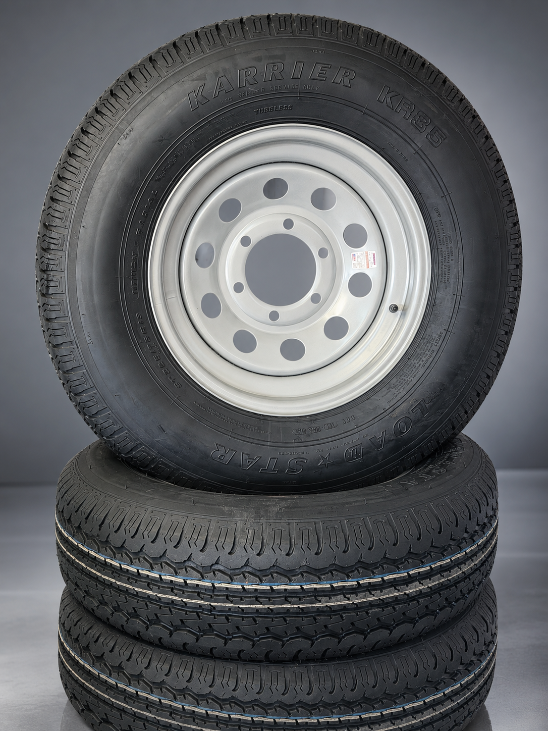 In-stock trailer tires on white and black wheels